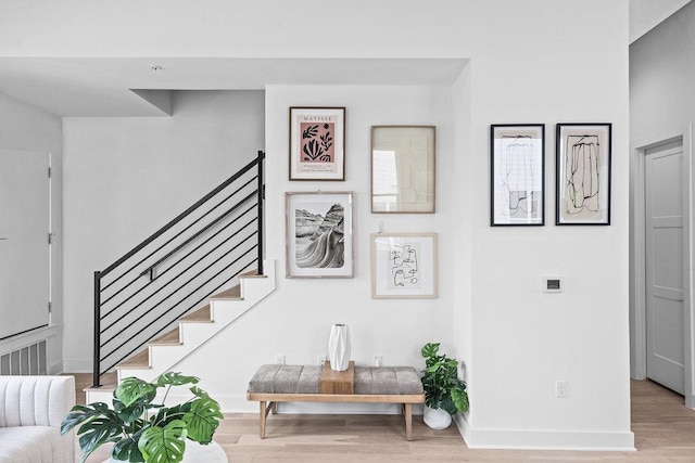 stairs featuring baseboards and wood finished floors