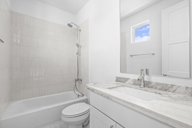full bathroom featuring shower / bath combination, vanity, and toilet