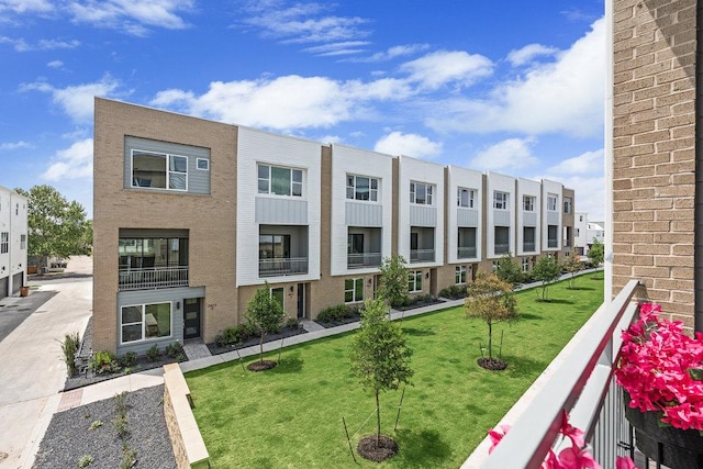 exterior space with a lawn and a residential view