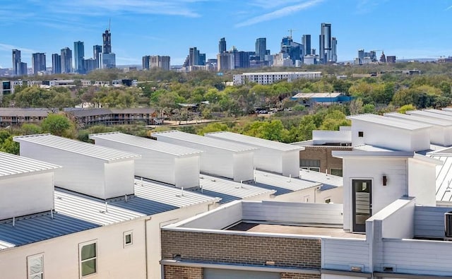birds eye view of property with a view of city