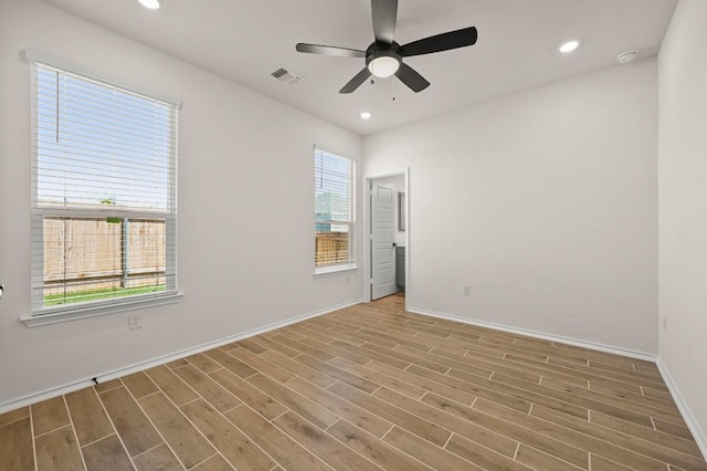 12106 Cantabria Rd, Austin, TX 78748 - empty room with wood finished floors, a ceiling fan, recessed lighting, and a smoke detector