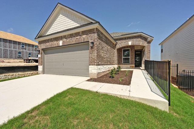 12106 Cantabria Rd, Austin, TX 78748 - view of front of house with brick siding, an attached garage, and concrete driveway