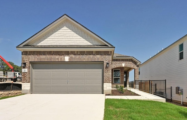 12106 Cantabria Rd, Austin, TX 78748 - view of front of home with brick siding, driveway, and a garage