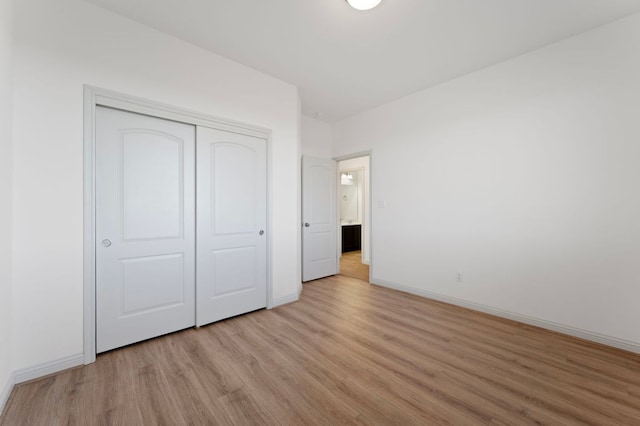 7313 Rimcrest Cv Unit A2, Austin, TX 78735 - unfurnished bedroom with light wood-style flooring and a closet