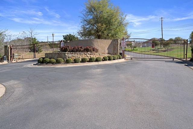 7313 Rimcrest Cv Unit A2, Austin, TX 78735 - community / neighborhood sign featuring a gate