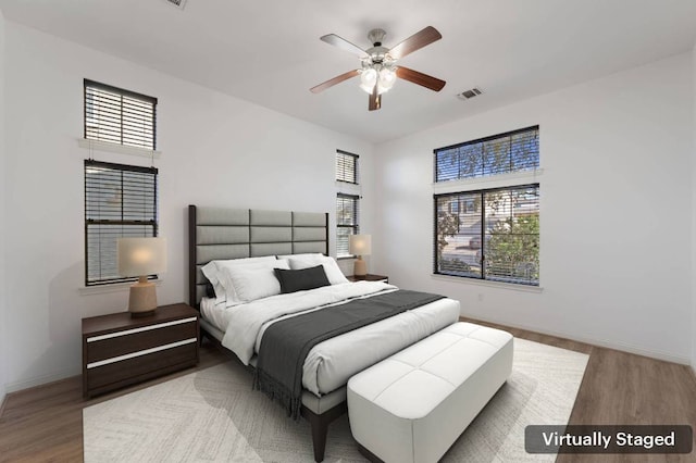7313 Rimcrest Cv Unit A2, Austin, TX 78735 - bedroom featuring wood finished floors and a ceiling fan