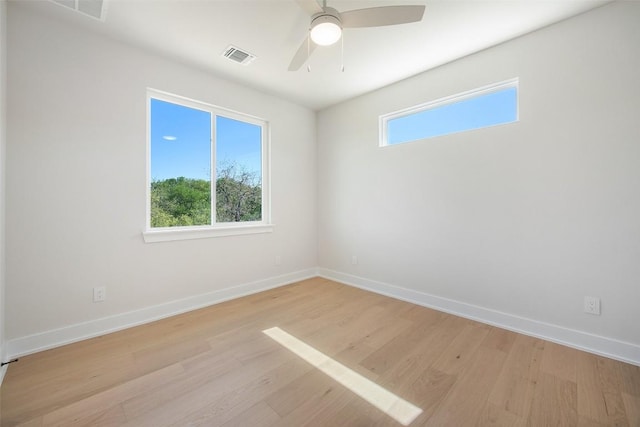6301 Bristol Cir Unit 2, Austin, TX 78723 - spare room featuring light wood-style flooring, baseboards, and a ceiling fan