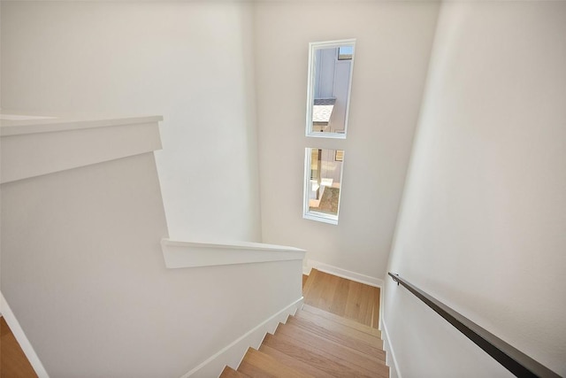 6301 Bristol Cir Unit 2, Austin, TX 78723 - stairway featuring wood finished floors and baseboards