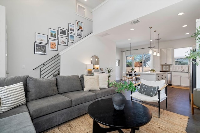 1126 Linden St Unit 1, Austin, TX 78702 - living area with recessed lighting, stairway, and wood finished floors