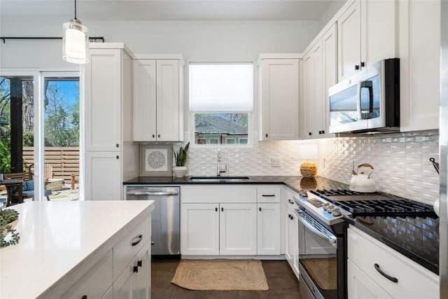 1126 Linden St Unit 1, Austin, TX 78702 - kitchen with appliances with stainless steel finishes, a sink, tasteful backsplash, and white cabinetry