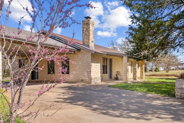 491 Herron Trl, Mcdade, TX 78650 - view of front of house featuring a chimney