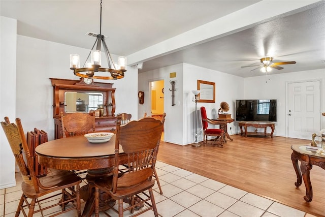 491 Herron Trl, Mcdade, TX 78650 - dining space featuring light tile patterned floors, a ceiling fan, and a chandelier