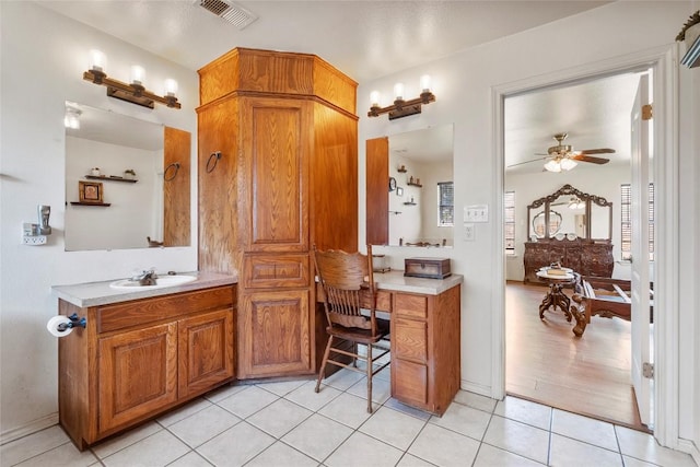491 Herron Trl, Mcdade, TX 78650 - bathroom with tile patterned flooring, vanity, and ceiling fan