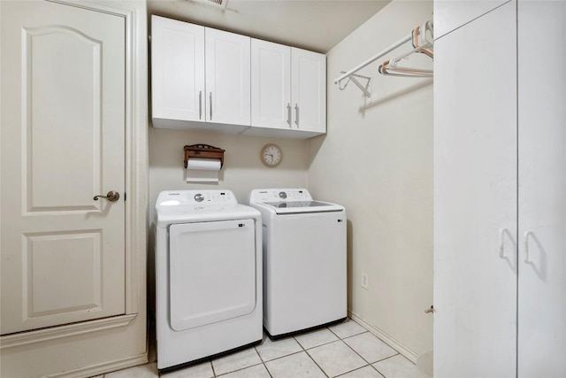491 Herron Trl, Mcdade, TX 78650 - washroom featuring cabinet space, independent washer and dryer, and light tile patterned floors