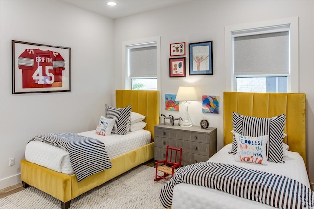 bedroom featuring recessed lighting, baseboards, and wood finished floors