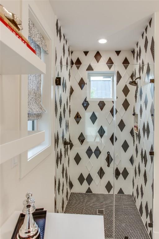 full bathroom with a tile shower