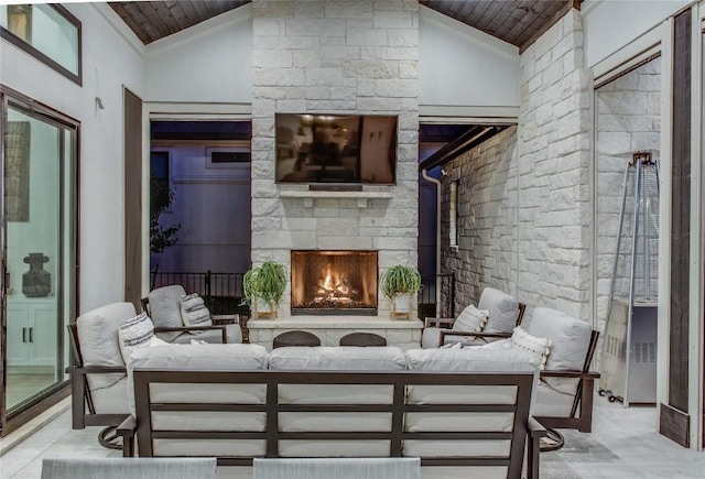 view of patio featuring an outdoor living space with a fireplace