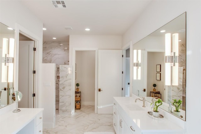 full bath with a marble finish shower, visible vents, recessed lighting, marble finish floor, and vanity