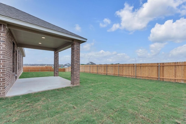 view of yard featuring a fenced backyard and a patio area