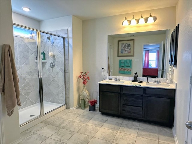 1208 Ravenside Cv, Leander, TX 78641 - full bathroom with double vanity, a shower stall, and tile patterned floors