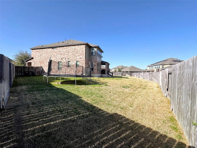 1208 Ravenside Cv, Leander, TX 78641 - fenced backyard with a trampoline