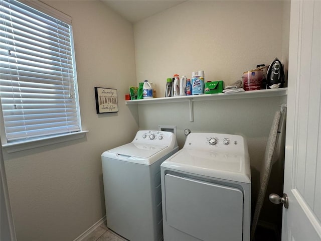 1208 Ravenside Cv, Leander, TX 78641 - laundry room with washer and clothes dryer and tile patterned flooring