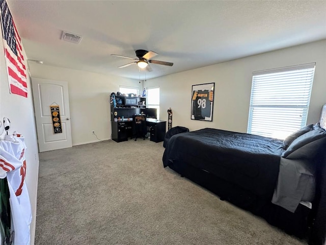 1208 Ravenside Cv, Leander, TX 78641 - bedroom with carpet flooring and a ceiling fan