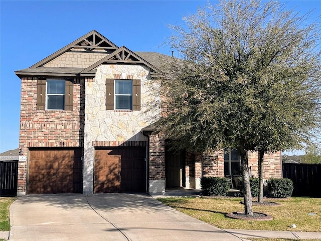 1208 Ravenside Cv, Leander, TX 78641 - view of front of property with an attached garage, driveway, brick siding, and stone siding