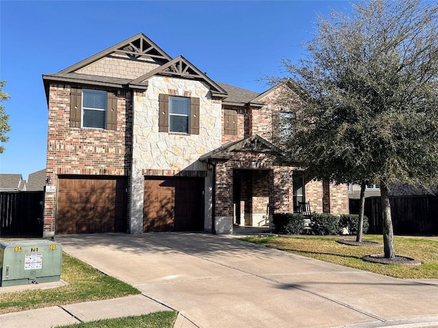 1208 Ravenside Cv, Leander, TX 78641 - view of front of home featuring a garage, brick siding, driveway, and stone siding