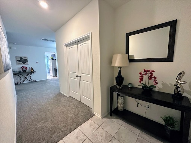 1208 Ravenside Cv, Leander, TX 78641 - hall with arched walkways and light colored carpet