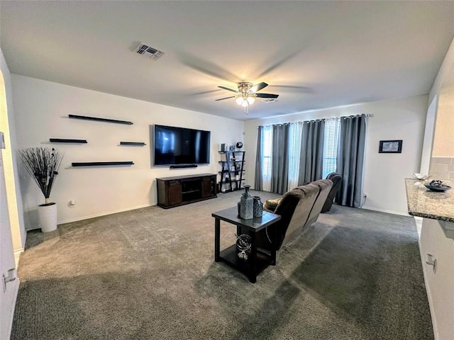 1208 Ravenside Cv, Leander, TX 78641 - carpeted living room featuring a ceiling fan and baseboards