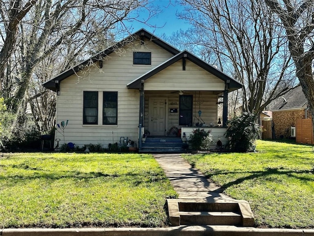 1106 Lexington St, Taylor, TX 76574 - bungalow-style house with a porch and a front yard