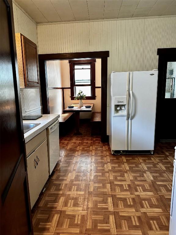 1106 Lexington St, Taylor, TX 76574 - kitchen with white appliances and light countertops