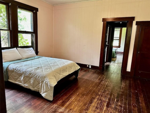 1106 Lexington St, Taylor, TX 76574 - bedroom with multiple windows and wood-type flooring