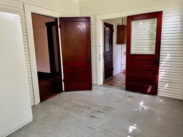 1106 Lexington St, Taylor, TX 76574 - hall with hardwood / wood-style floors and wood walls