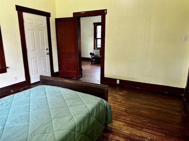 1106 Lexington St, Taylor, TX 76574 - bedroom with baseboards and hardwood / wood-style flooring
