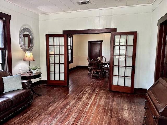 1106 Lexington St, Taylor, TX 76574 - interior space featuring hardwood / wood-style flooring, french doors, visible vents, crown molding, and baseboards