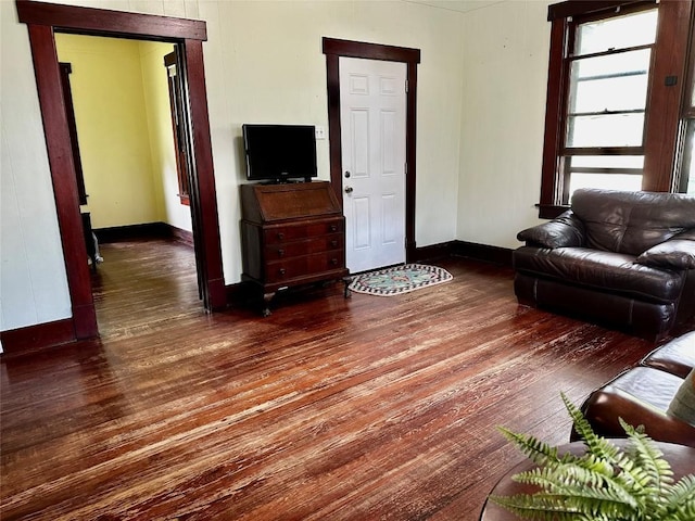 1106 Lexington St, Taylor, TX 76574 - living area featuring baseboards and wood finished floors