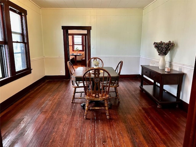 1106 Lexington St, Taylor, TX 76574 - dining space featuring ornamental molding, wood-type flooring, and baseboards
