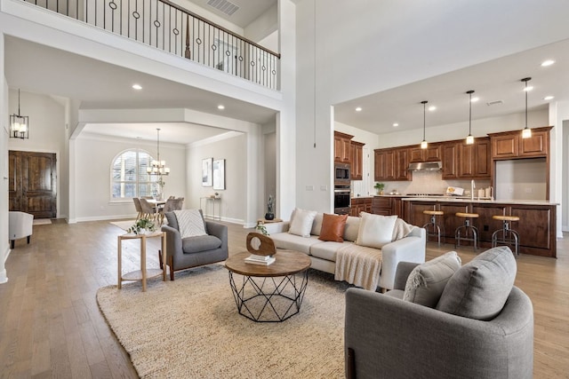4709 Napoli Shore Dr, Leander, TX 78641 - living area with a chandelier, light wood-type flooring, and recessed lighting