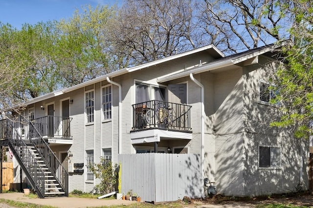 2712 Windswept Cv, Austin, TX 78745 - view of property exterior featuring stairs and a balcony