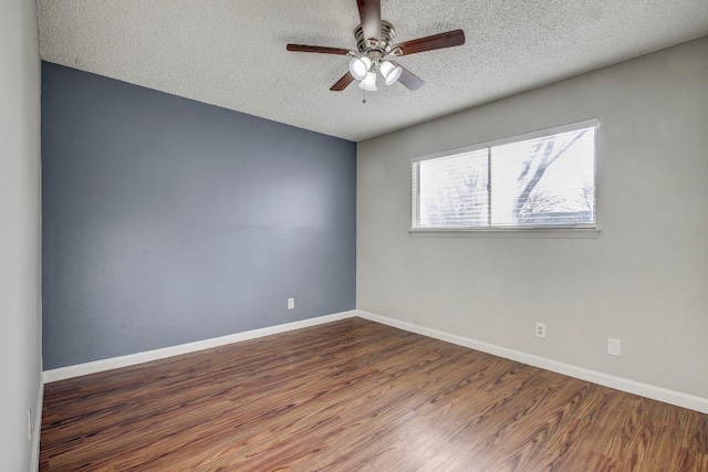 2712 Windswept Cv, Austin, TX 78745 - unfurnished room with a textured ceiling, wood finished floors, and ceiling fan