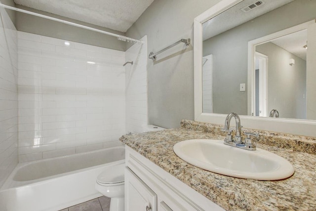 2712 Windswept Cv, Austin, TX 78745 - full bathroom with vanity, shower / washtub combination, tile patterned flooring, and a textured ceiling