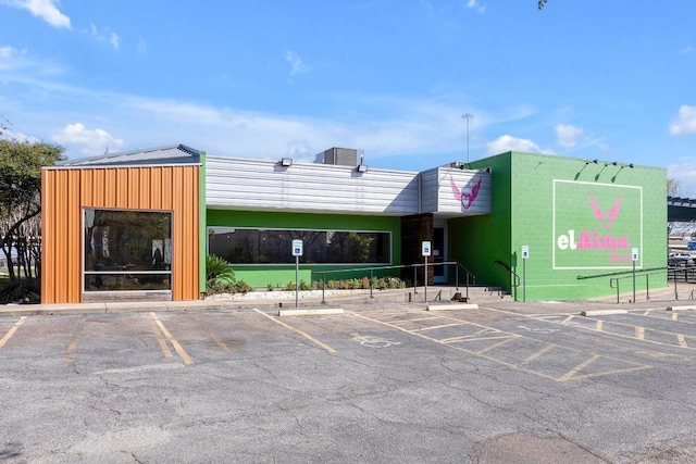 2712 Windswept Cv, Austin, TX 78745 - view of commercial property featuring uncovered parking