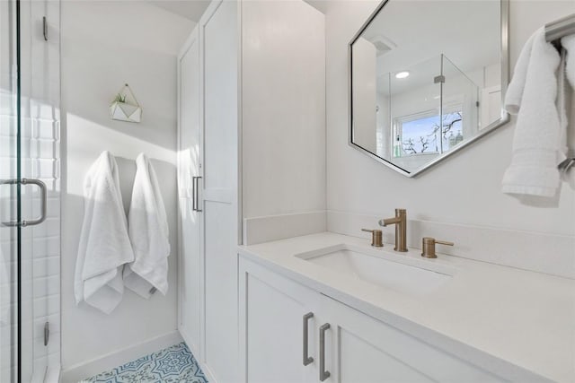 full bathroom with vanity and a stall shower