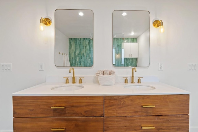 bathroom featuring a sink and double vanity