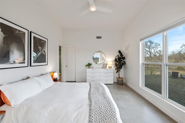 bedroom with concrete flooring, a ceiling fan, visible vents, and baseboards