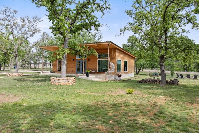 444 Klein Rd, Stonewall, TX 78671 - view of front of home with a front lawn