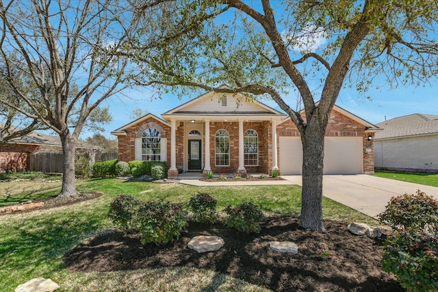 3905 Stonehenge Path, Round Rock, TX 78681 - greek revival inspired property with a garage, driveway, and brick siding