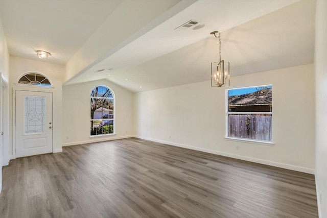 3905 Stonehenge Path, Round Rock, TX 78681 - entryway with lofted ceiling, wood finished floors, a chandelier, and baseboards